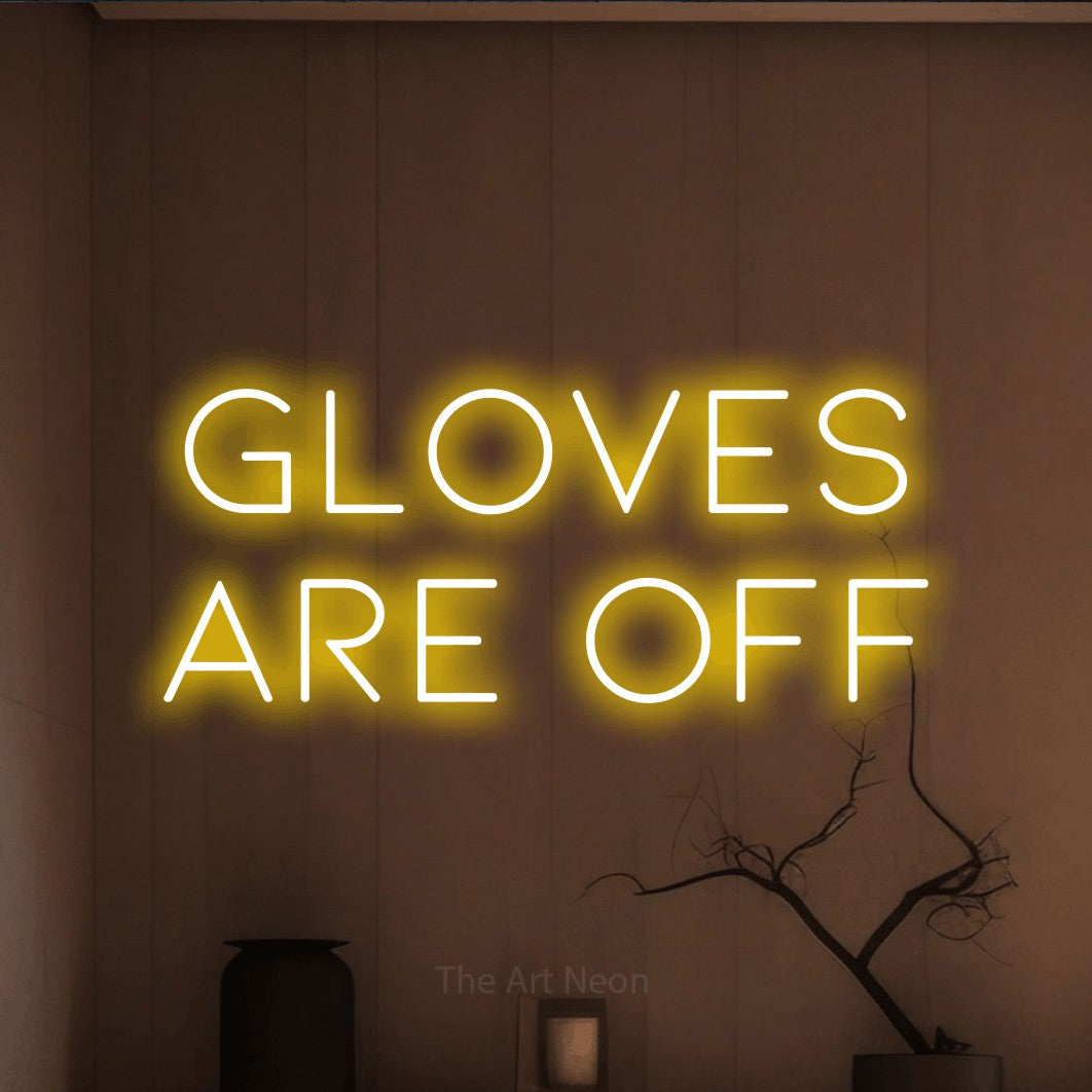 Yellow LED neon sign reading "Gloves Are Off" against a warm brown wall