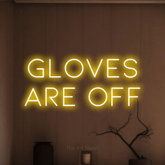 Yellow LED neon sign reading "Gloves Are Off" against a warm brown wall