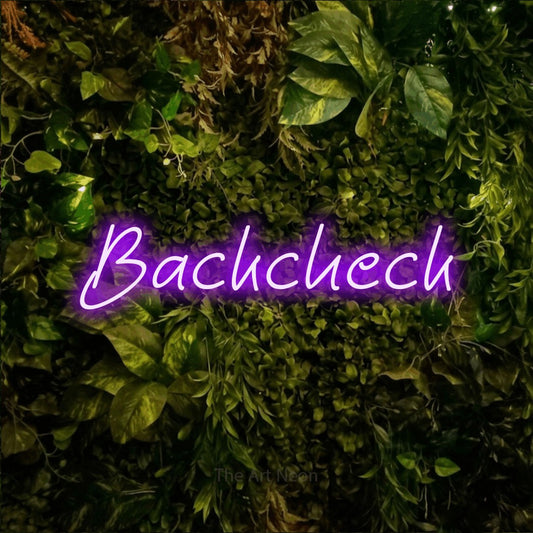 Purple LED neon sign reading "Backcheck" against a textured moss and foliage wall