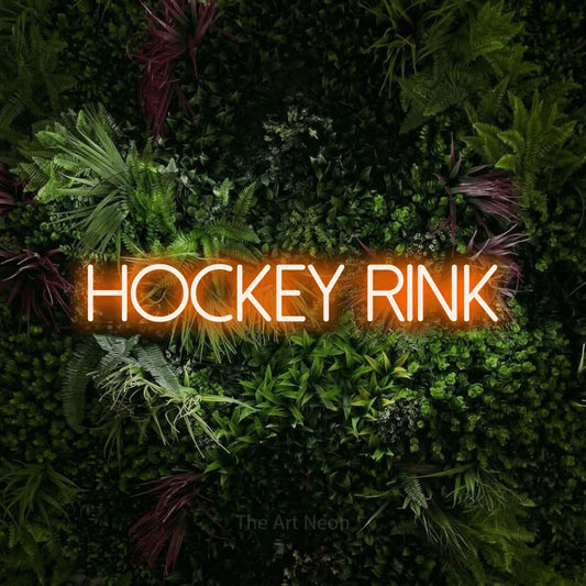 Orange LED neon sign reading "Hockey Rink" against a lush garden wall with pink flowers