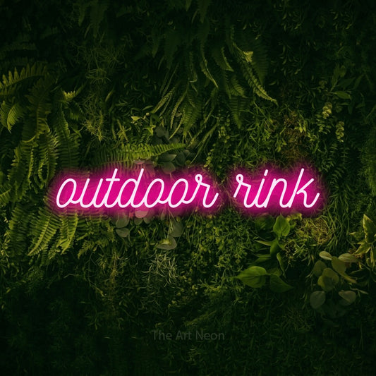 Hot pink script-style LED neon sign reading "Outdoor Rink" against a moss-covered green wall