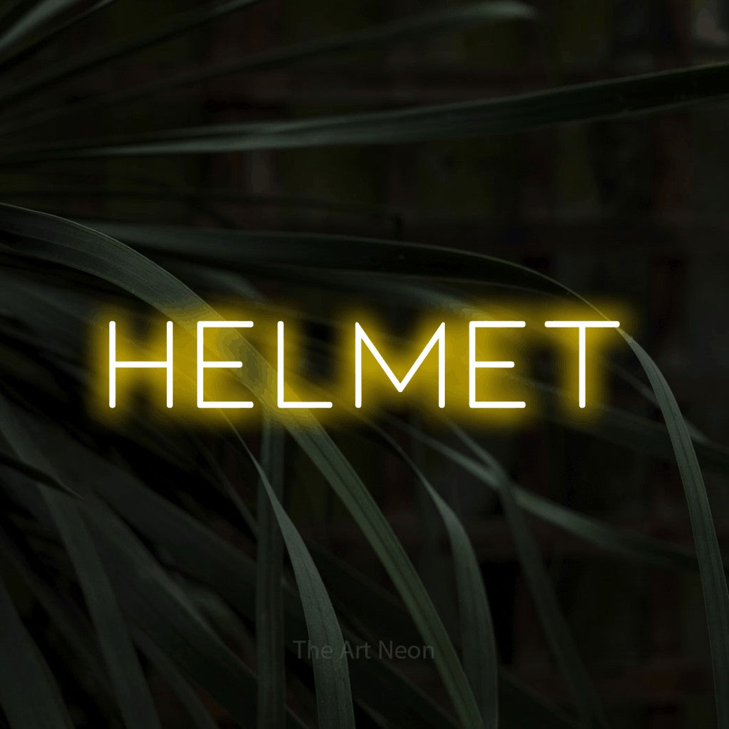 Yellow LED neon sign reading "Helmet" against dark tropical leaves