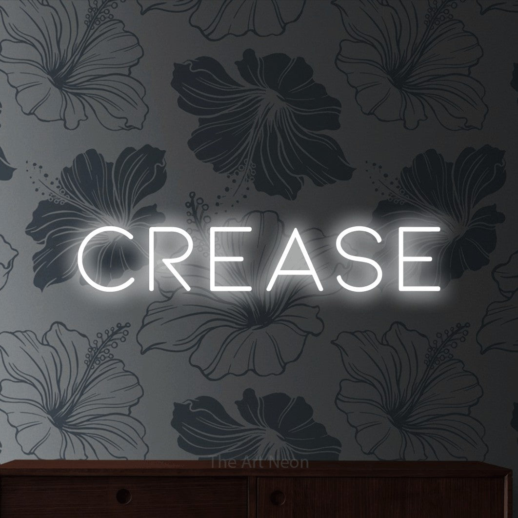 Cool white LED neon sign reading "Crease" against grey floral wallpaper