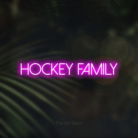 Pink LED neon sign reading "Hockey Family" against dark blurred palm leaves