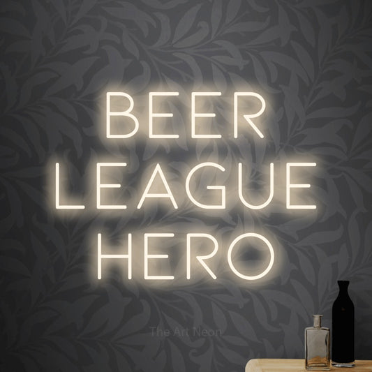 Warm white LED neon sign reading "Beer League Hero" against light grey floral wallpaper