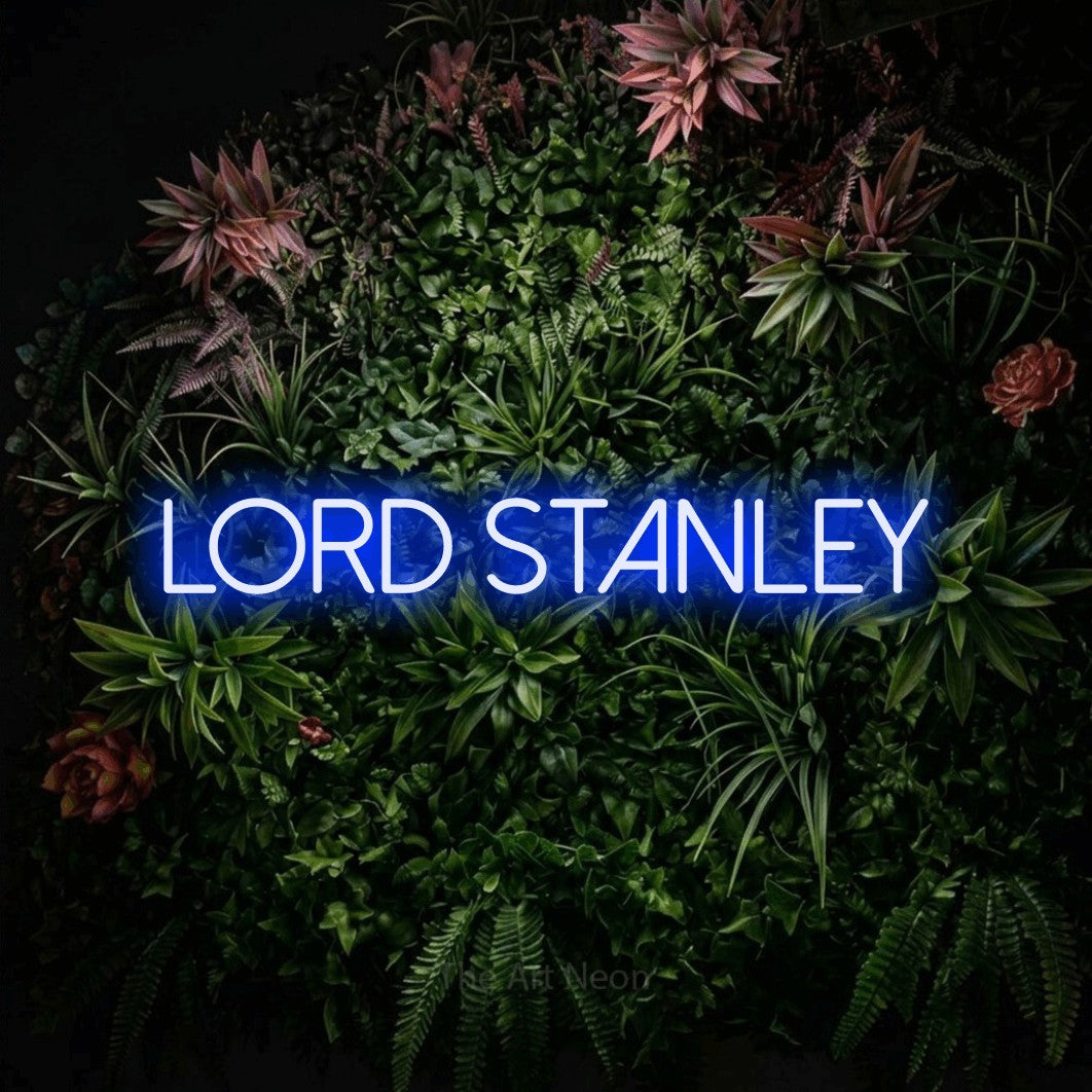 Blue LED neon sign reading "Lord Stanley" against a flowering garden wall