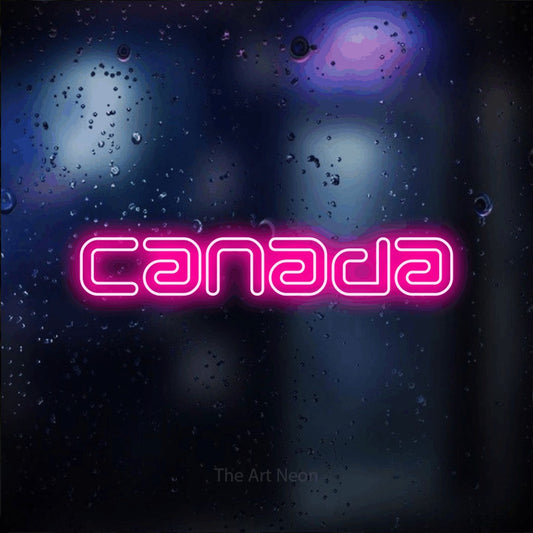 Hot pink outline-style LED neon sign reading "Canada" against a dark blue bokeh background