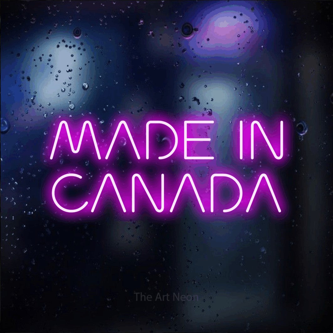 Enseigne néon à DEL à lumière rose, affichant « Made in Canada » sur un arrière-plan bokeh bleu foncé