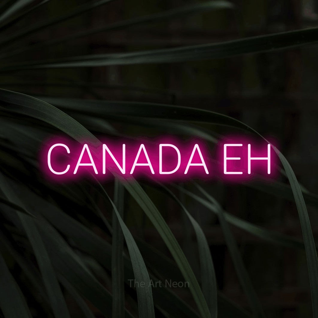 Enseigne néon à DEL à lumière rose vif, affichant « Canada Eh » sur des feuilles tropicales foncées