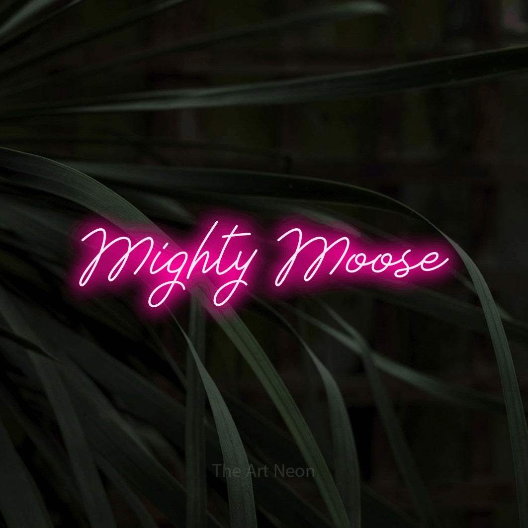 Hot pink script-style LED neon sign reading "Mighty Moose" against dark tropical leaves