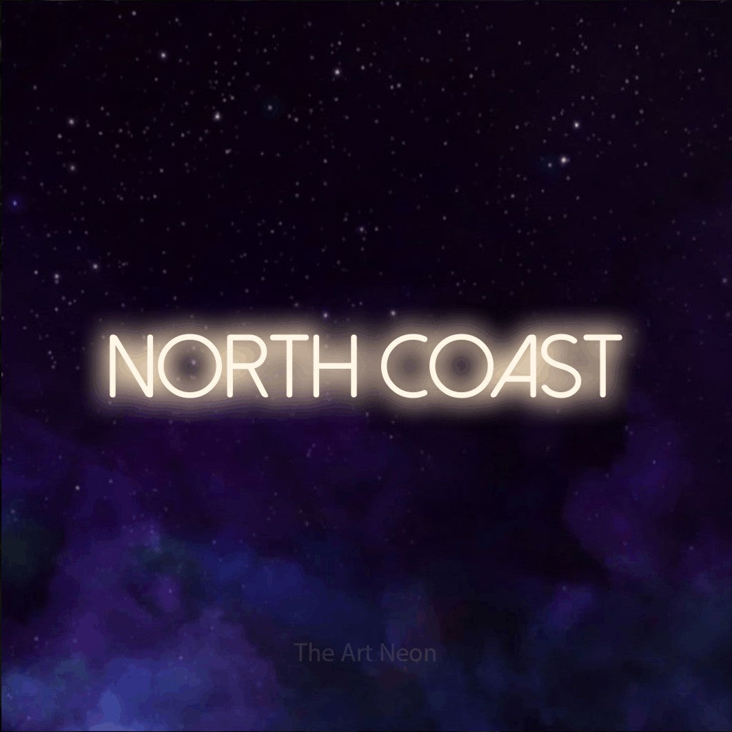 Warm white LED neon sign reading "North Coast" against a purple galaxy background