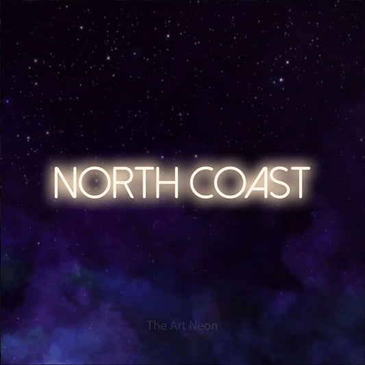 Warm white LED neon sign reading "North Coast" against a purple galaxy background