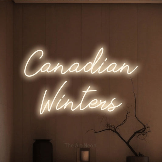 Warm white script-style LED neon sign reading "Canadian Winters" against a warm brown wall