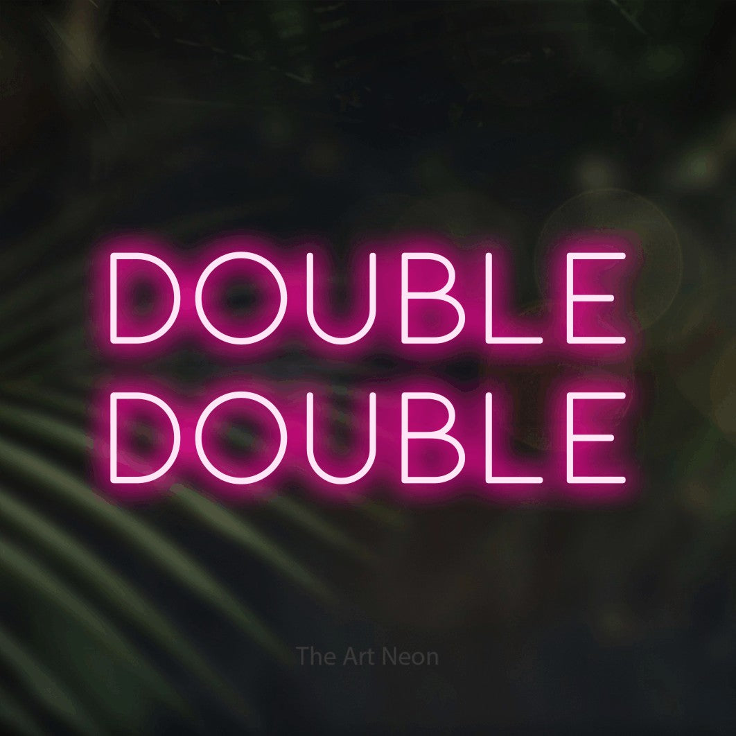 Hot pink LED neon sign reading "Double Double" against dark blurred palm leaves