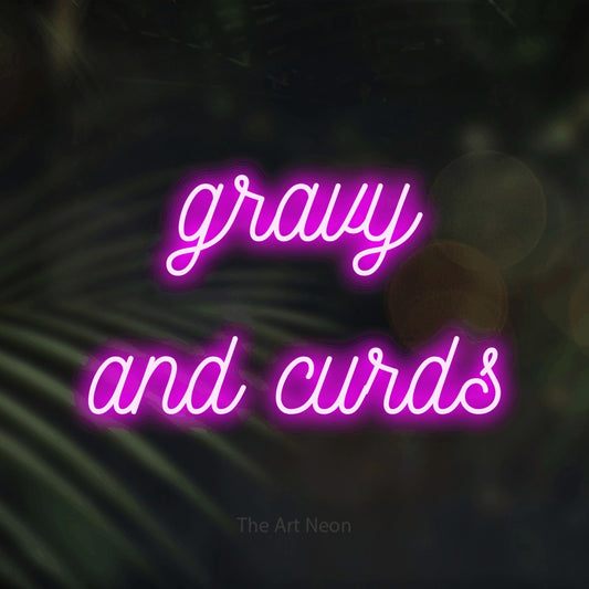 Enseigne néon à DEL à lumière rose, de style manuscrit, affichant « Gravy and Curds » sur des feuilles de palmier foncées et floues