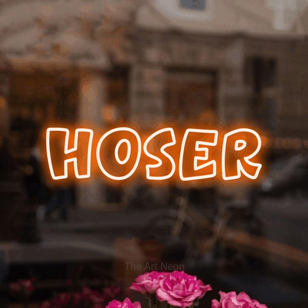 Orange outline-style LED neon sign reading "Hoser" in a softly blurred café interior