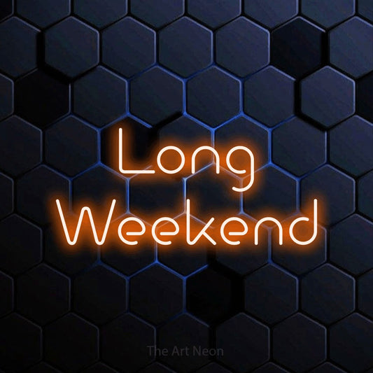 Orange LED neon sign reading "Long Weekend" against a blue hexagonal wall