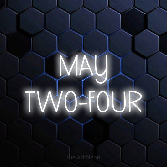 Cool white LED neon sign reading "May Two-Four" against a blue hexagonal wall