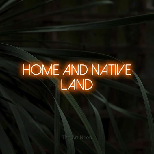 Orange LED neon sign reading "Home and Native Land" against dark tropical leaves