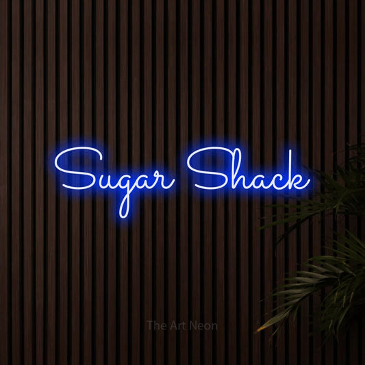 Blue LED neon sign reading "Sugar Shack" against dark wooden slats
