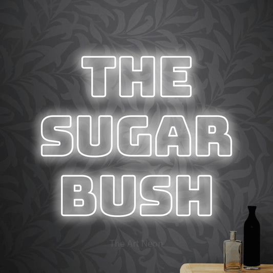 Cool white outline-style LED neon sign reading "The Sugar Bush" against light grey floral wallpaper