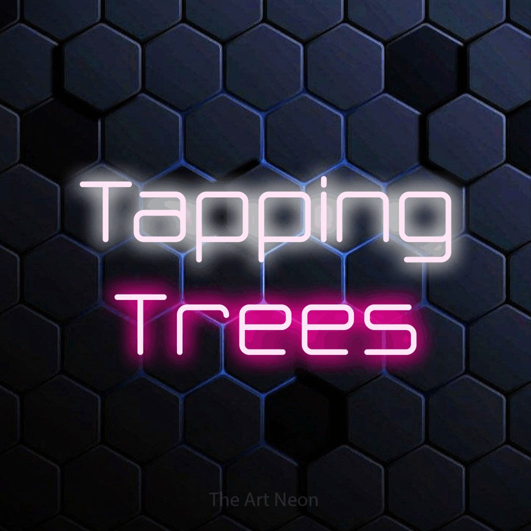 Hot pink and cool white LED neon sign reading "Tapping Trees" against a blue hexagonal wall