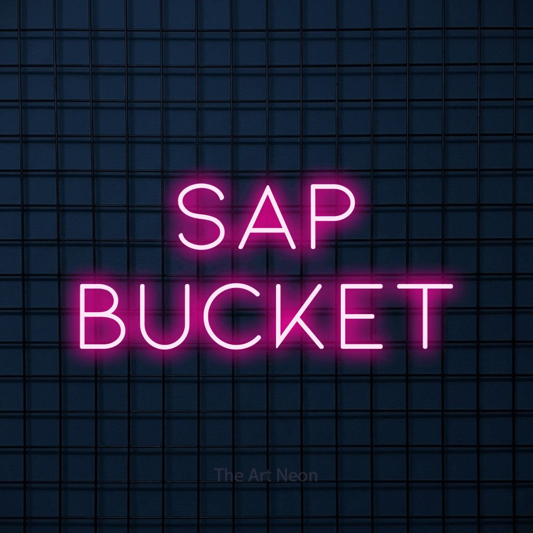Hot pink LED neon sign reading "Sap Bucket" against a dark blue tiled wall