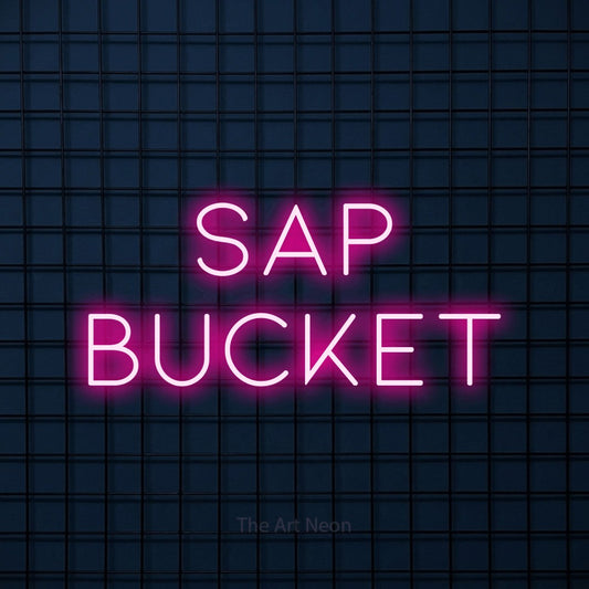 Hot pink LED neon sign reading "Sap Bucket" against a dark blue tiled wall