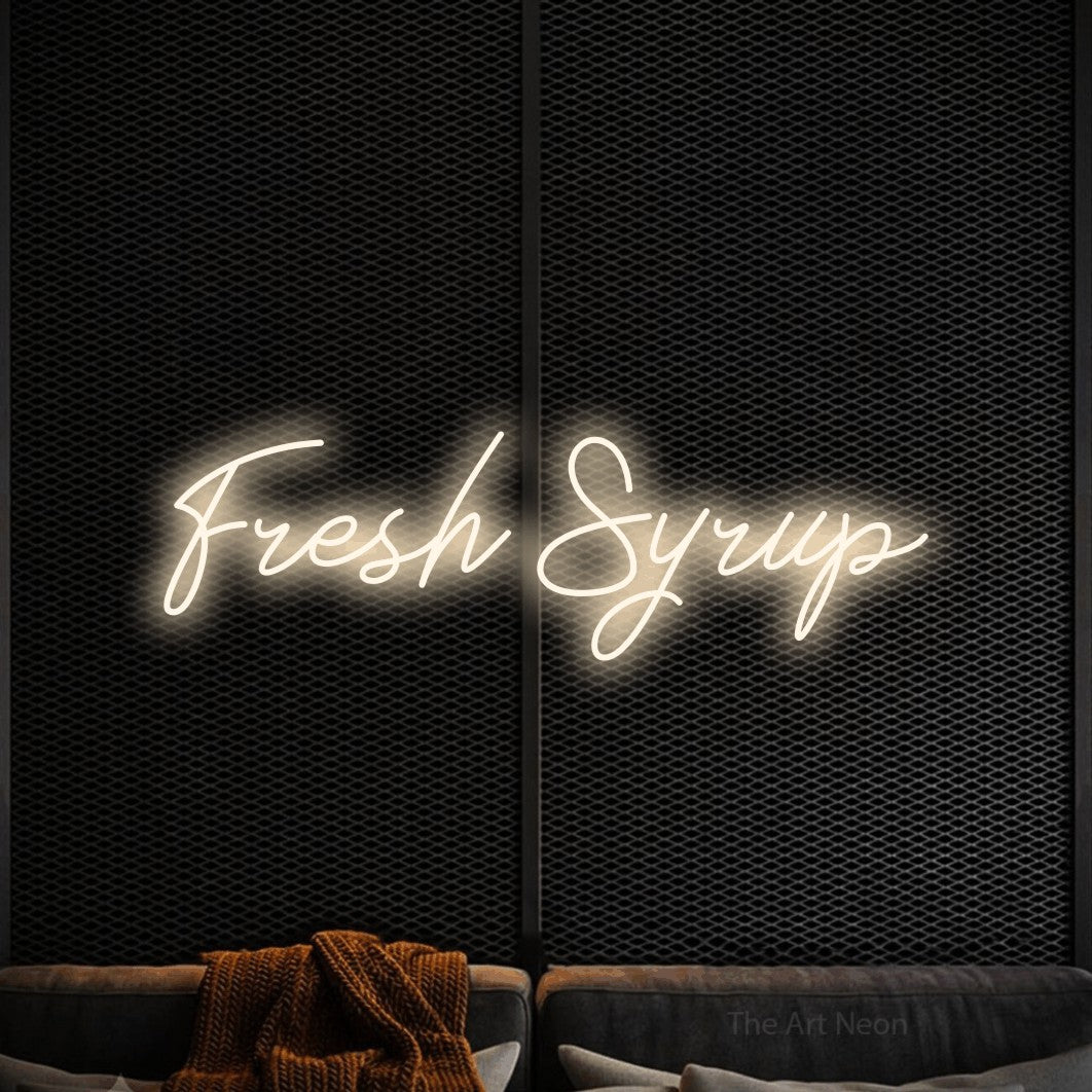 Warm white script-style LED neon sign reading "Fresh Syrup" against a black textured wall