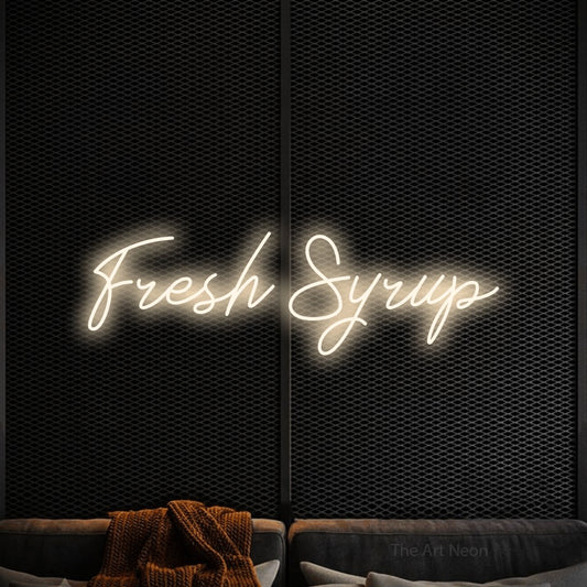 Warm white script-style LED neon sign reading "Fresh Syrup" against a black textured wall