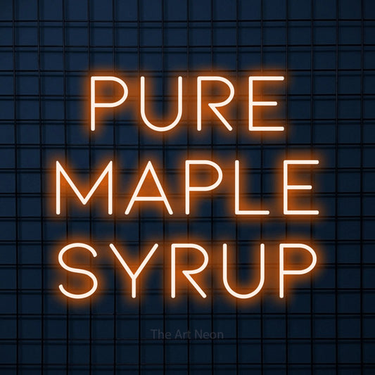Orange LED neon sign reading "Pure Maple Syrup" against a dark blue tiled wall