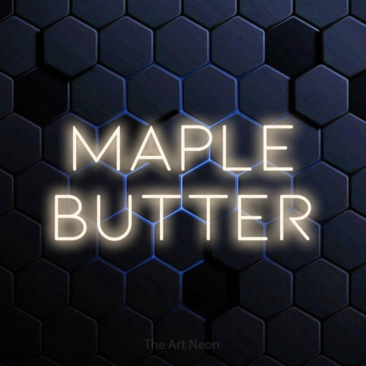 Warm white LED neon sign reading "Maple Butter" against a blue hexagonal wall