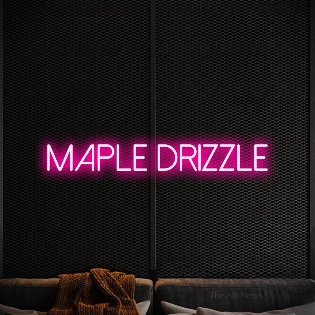 Hot pink LED neon sign reading "Maple Drizzle" against a black textured wall