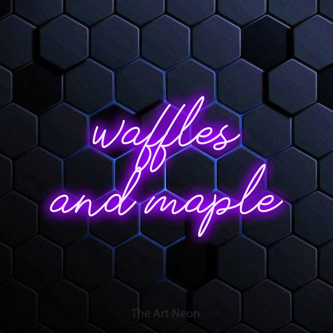 Purple script-style LED neon sign reading "Waffles and Maple" against a blue hexagonal wall