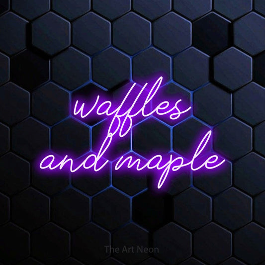 Purple script-style LED neon sign reading "Waffles and Maple" against a blue hexagonal wall