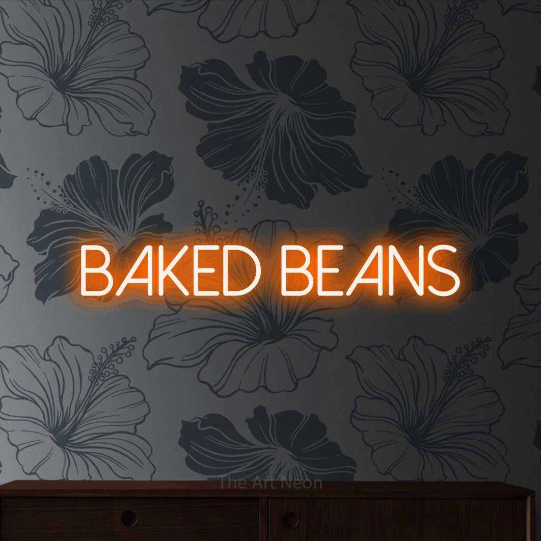 Orange LED neon sign reading "Baked Beans" against grey floral wallpaper