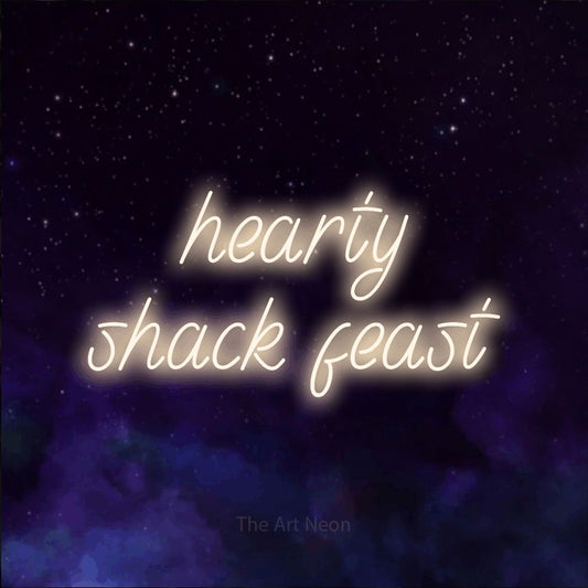 Warm white LED neon sign reading "Hearty Shack Feast" against a purple galaxy background