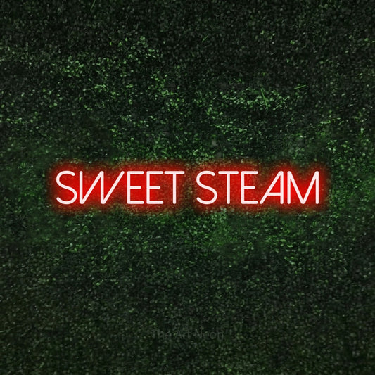 Red LED neon sign reading "Sweet Steam" against a textured green moss wall