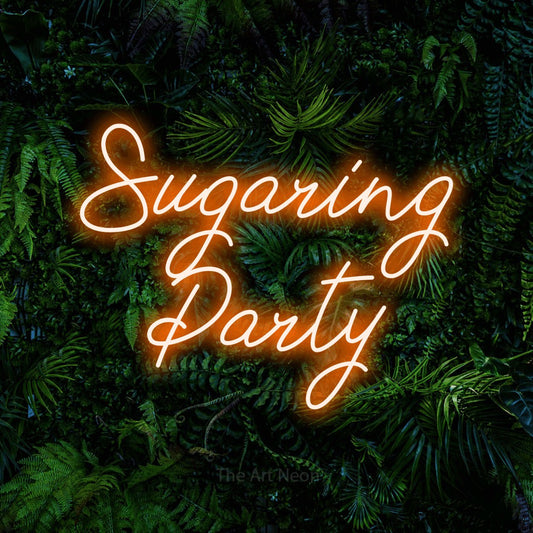 Orange script-style LED neon sign reading "Sugaring Party" against a dense tropical foliage wall