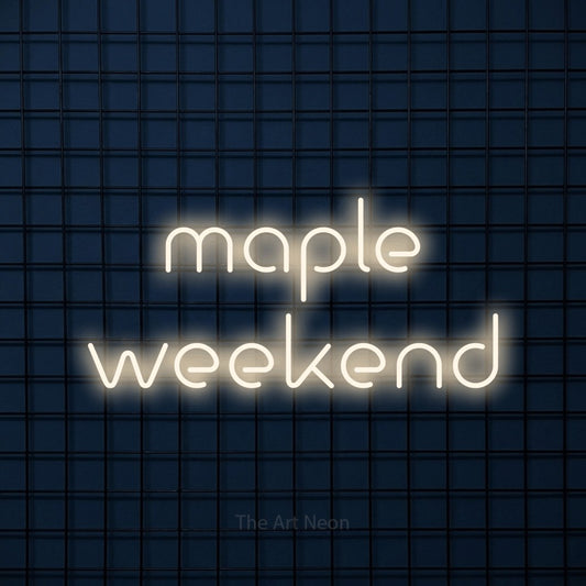 Warm white LED neon sign reading "Maple Weekend" against a dark blue tiled wall