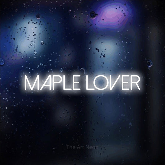 Cool white LED neon sign reading "Maple Lover" against a dark blue bokeh background