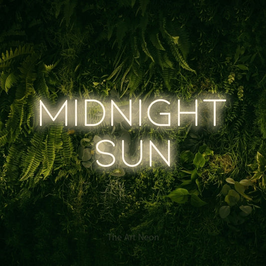 Warm white LED neon sign reading "Midnight Sun" against a moss-covered green wall