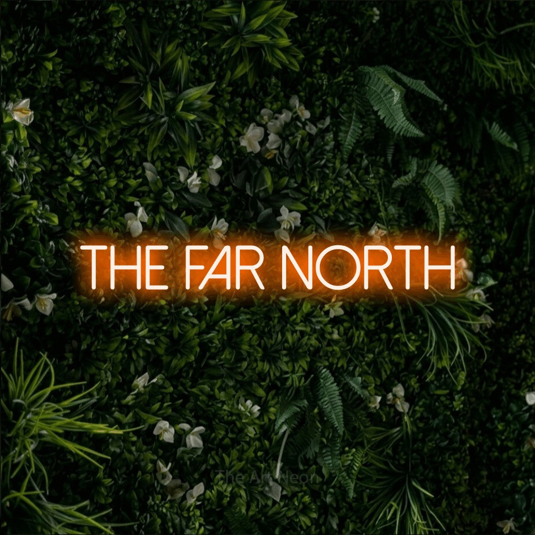 Orange LED neon sign reading "The Far North" against a leafy green wall
