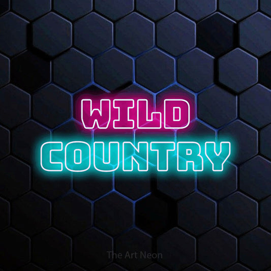 Ice blue and hot pink outline-style LED neon sign reading "Wild Country" against a blue hexagonal wall