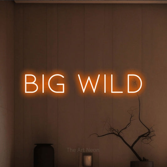 Orange LED neon sign reading "Big Wild" against a warm brown wall