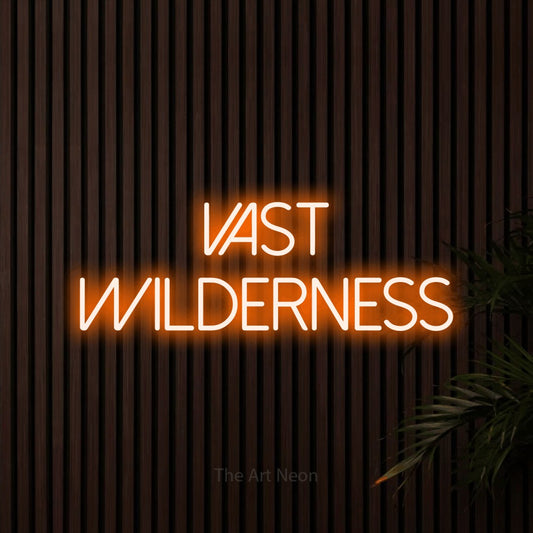Orange LED neon sign reading "Vast Wilderness" against dark wooden slats