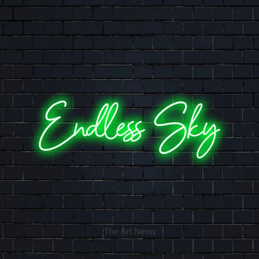 Green script-style LED neon sign reading "Endless Sky" against a dark navy brick wall