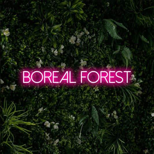 Hot pink LED neon sign reading "Boreal Forest" against a leafy green wall