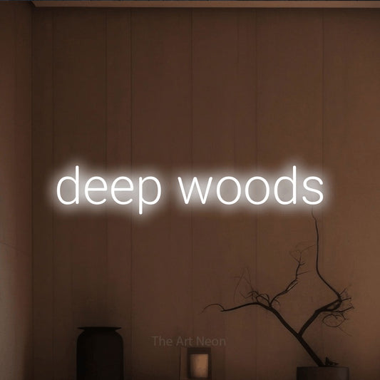 Cool white LED neon sign reading "Deep Woods" against a warm brown wall