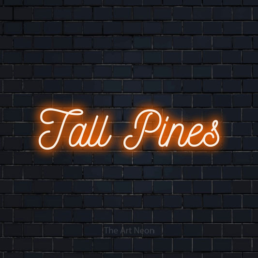 Orange script-style LED neon sign reading "Tall Pines" against a dark navy brick wall